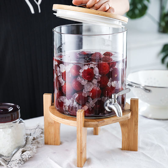 glass juice dispenser with wooden stand